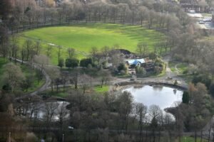 Alexandra Park Manchester with lakeside walking paths and Victorian green spaces