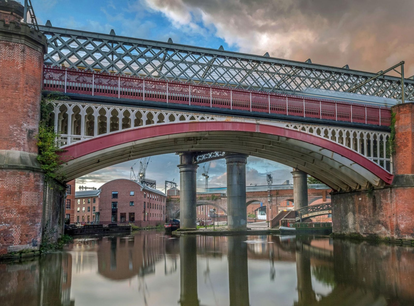 Castlefield Manchester canal basin with Victorian railway viaducts and historic waterfront