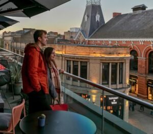 Couple enjoying a romantic day out in Manchester, exploring museums, canals, parks, restaurants, and city centre attractions.