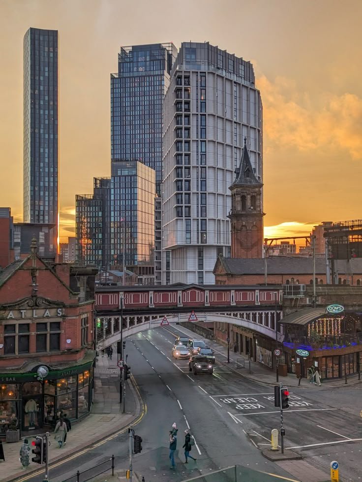 Manchester city centre skyline with Beetham Tower Manchester Town Hall Victorian architecture and Metrolink tram network