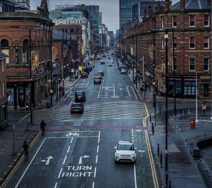 Manchester skyline with canals museums and Salford Quays waterfront showing free things to do in Manchester